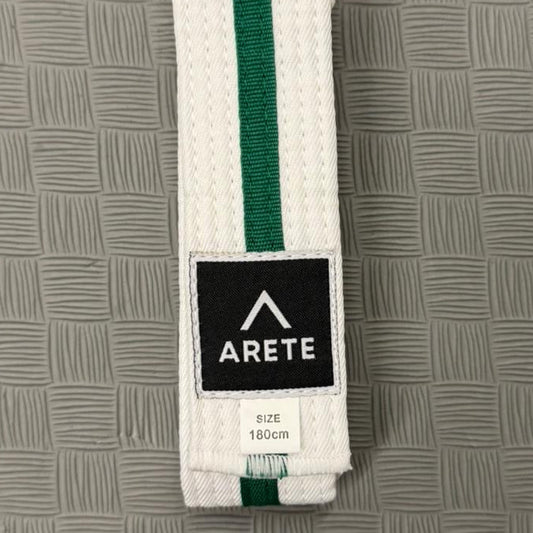 Green and white belt with Arete logo on a textured gray background