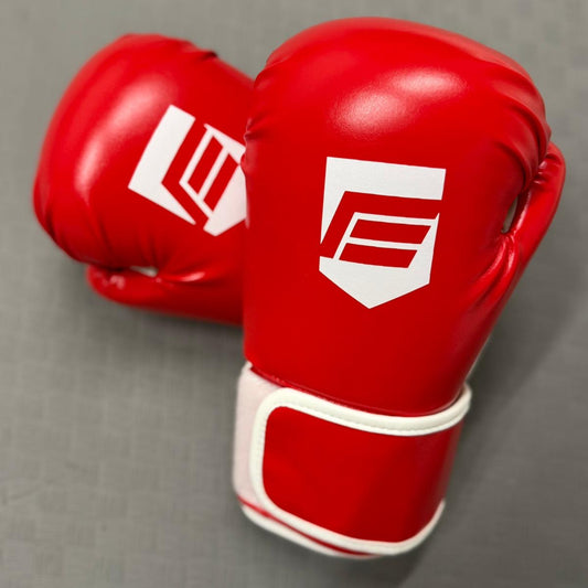 Red boxing gloves with white logos on a gray background